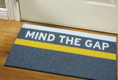 'Mind the Gap' door mat