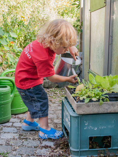 Child with watering can