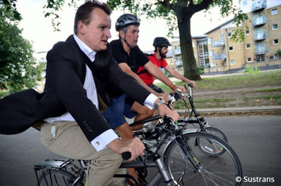 People cycling to work in town