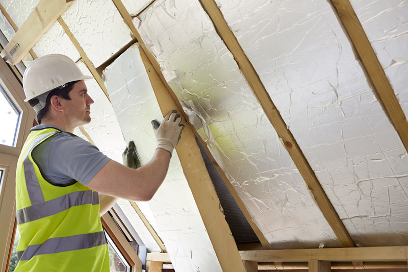 Insulation board being fitted in a home