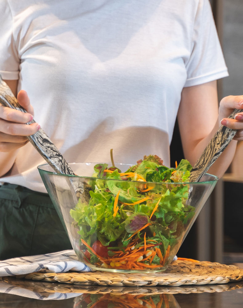 Mixing a healthy vegan salad