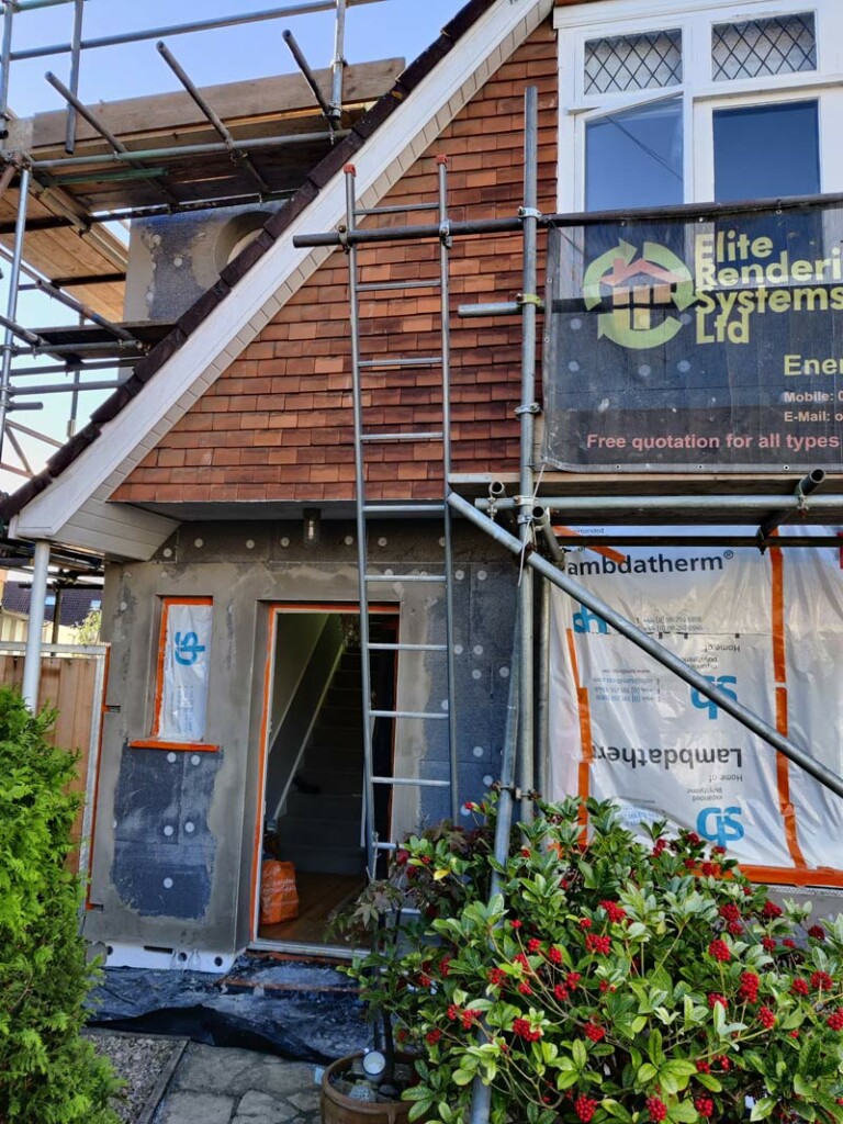 House exterior while insulation is being installed