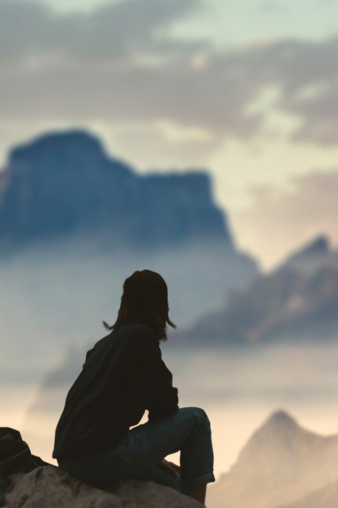 Woman looking at rugged landscape