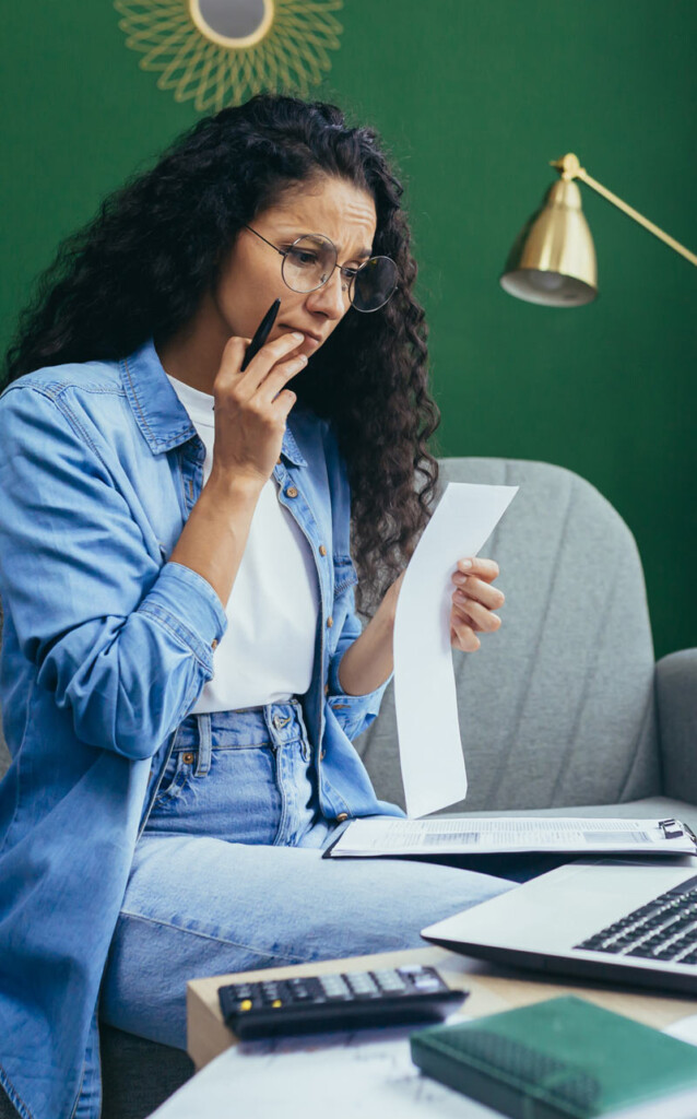 Woman looking at bills